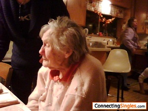 My mother, who passed away at 96 in 2009.  Nephew standing next to her, and his wife in background.  Mom's last birthday party.  Died 3 months later.