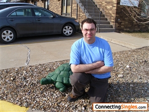 This is me in front of one of the two turtle statues that adorn the entryway of my apartment complex