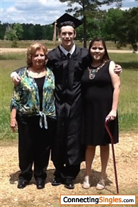 Me my oldest daughter and my grandson on his graduation from high school