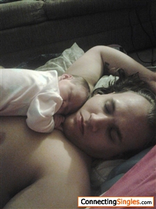 Me snuggling with my daughter when she was first born