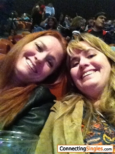 Me and sis at a concert Im the one with red hair