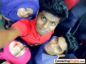 Me in a Red t shirt with my friends at university campus