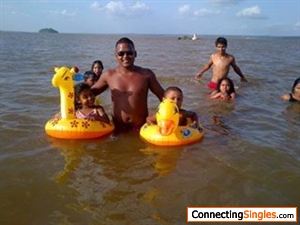 Me and my kids in waters a the golden beach bartica
