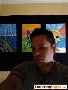 Here I am standing next to some of my artworks