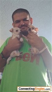 me holding my older sisters dog and my dog too when they were puppies