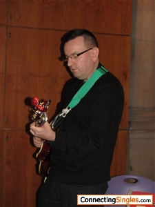 Playing guitar in local museum.