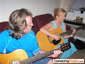 Me playing guitar with one of my friends Kurt and his wife.. who is not in the picture