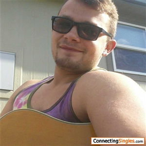Me enjoying the sun and my acoustic guitar i play so well lol