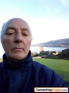 This selfie was taken in the north of Scotland; in my background are Loch Ness ("Loch" is Scots for "lake") and Urquhart Castle.