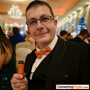 at an orange tie ball for suicide awarness