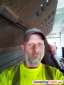 At work standing in a front end loader bucket