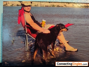 Drink'en coffee in the Kaw River with my dog Gunta.