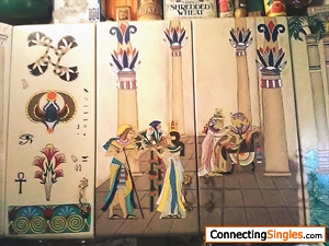 Center of the kitchen cabinets I painted. The two doors run the same scene. The door to the left is a filler door. To the right of the center is the Bastet one. I painted a post to over lap so the las
