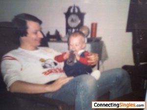 My nephew sitting on my lap, ca. 1984.