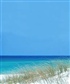 Beautiful white sand and blue water of Pensacola Beach