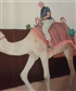 riding a camel on the desert safari