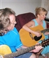 Me playing guitar with one of my friends Kurt and his wife who is not in the picture