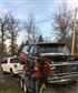 Older photo standing beside the old bronco when it was first brought home