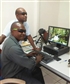 My work collegue and myself in my office with me standing in sun glass